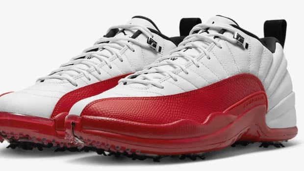 View of white and red Air Jordan shoes.